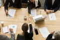 Two businesswomen shaking hands at group meeting, top view Royalty Free Stock Photo