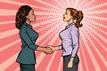 Two businesswomen shaking hands