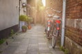 Two bycicles near stone wall