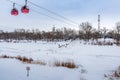 Two cabins of a cable car across the Ural River in winter