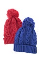 Two cable knit winter ski hats isolated on white background Royalty Free Stock Photo