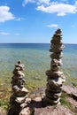 Two cairns on the rocky shoreline of Lake Michigan at Cave Point County Park in Wisconsin Royalty Free Stock Photo