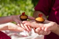 Two cakes on male and female hands Royalty Free Stock Photo