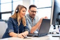 Two call center agents working together Royalty Free Stock Photo