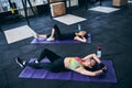 Trainer and her client resting after the workout