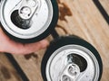 Two can of beer, female and male hands Royalty Free Stock Photo