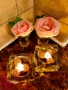 Two Candlelights And Two Pink Roses??