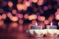 Two Candles Against A Background With Bokeh Royalty Free Stock Photo