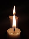 Two candles burning in the dark Royalty Free Stock Photo