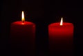 Two candles, dark background, christmas time Royalty Free Stock Photo