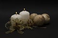 Two candles and golden bonds and balls. Royalty Free Stock Photo