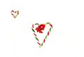 Two candy cane heart shapes on white background Royalty Free Stock Photo