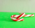 Two candy canes that is entwined together