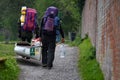 Two canoeists carry their canoe towards Caen Hill Flight Royalty Free Stock Photo