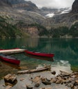 Two canoes awaiting use in the Canadian Rockies in Yoho National Park Royalty Free Stock Photo