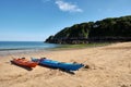 Two canoes, Barafundle Beach,Bay near Stackpole,Pembrokeshire,Wales,U.K Royalty Free Stock Photo