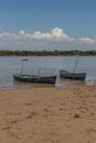 Two canoes moored on the river bank Royalty Free Stock Photo