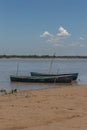 Two canoes moored on the river bank Royalty Free Stock Photo