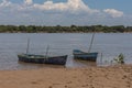 Two canoes moored on the river bank Royalty Free Stock Photo