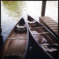 Two Canoes at a Pier in the Water Royalty Free Stock Photo