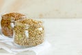 Two cans of buckwheat on white table with copy space. Royalty Free Stock Photo