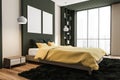 Two canvases on wall in dark green and yellow bedroom. Corner view