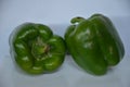 Two capsicum together keep their and the are all green Royalty Free Stock Photo