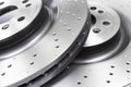 Two car brake disc background texture. Auto spare parts. Perforated brake disc rotor. Braking ventilated discs. Quality spare