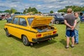 Two men admiring a classic Volvo 66GL at a public car show Royalty Free Stock Photo