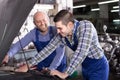 Two car mechanics at workshop Royalty Free Stock Photo