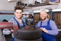 Two car mechanics at workshop Royalty Free Stock Photo