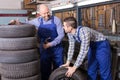 Two car mechanics at workshop Royalty Free Stock Photo