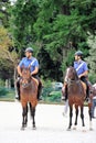 Two Carabinieri, Italian horse police on patrol in the city park