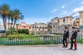 Ortigia/ Syracuse Sicily/ Italy - october 04 2019: Two Carabinieri keep watch in the vicinity of the temple of Apollo in Syracuse