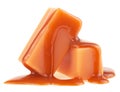 Two caramel candies and milk caramel sauce isolated on white background Royalty Free Stock Photo