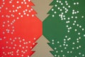 Two cardboard Christmas trees on a red and white background with place to insert Royalty Free Stock Photo