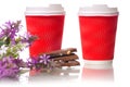 Two cardboard coffee cups chocolate flowers Royalty Free Stock Photo