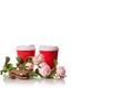 Two cardboard coffee cups chocolate flowers Royalty Free Stock Photo