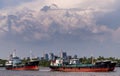 Two cargo ships parked in the middle of the river and Dramatic sky background Royalty Free Stock Photo