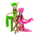 Two carnival dancer women dancing against isolated white background
