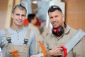 Two carpenters posing to camera Royalty Free Stock Photo