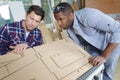 two carpenters working in shop wood craftsman Royalty Free Stock Photo