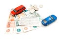 Two cars, driving license, coins and money Royalty Free Stock Photo