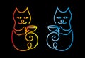 Two cartoon colorful cat on a black background with cups of coffee or tea. Text - Coffee Cup Royalty Free Stock Photo