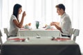 Two casual young adults having a conversation over a meal.Formal proposal,talking in a restaurant.Trying food,offers,special menu