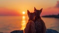 Two cats enjoying a stunning sunset together by the sea