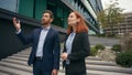 Two Caucasian business partners businesspeople meeting in city near office building shake hands partners entrepreneurs Royalty Free Stock Photo