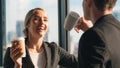 Two caucasian business people look happy while having business talk and drinking coffee in office Royalty Free Stock Photo