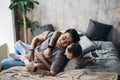 Two caucasian gay guys hugging and having fun in bed indoors Royalty Free Stock Photo