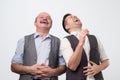 Two caucasian men laughing on his friends joke Royalty Free Stock Photo